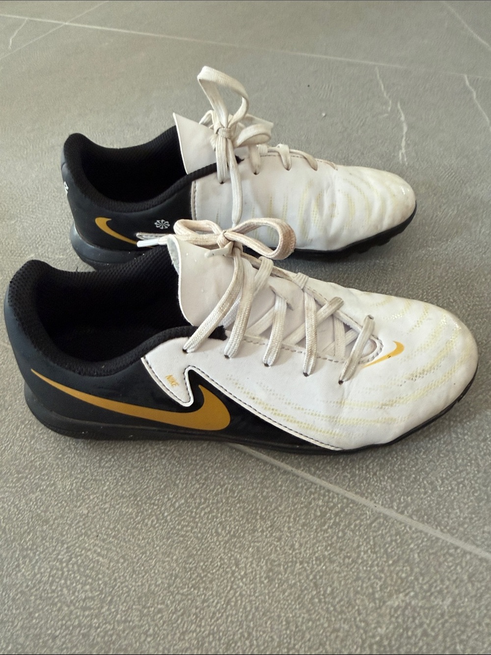 Nike Kids White, Black and Gold Turf Soccer Shoes
